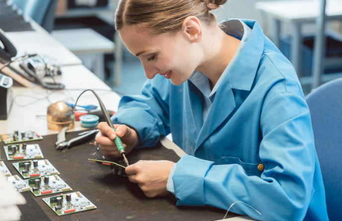Worker in Electronics Manufacturing Soldering a Component - Photos by Canva 2023-08-24